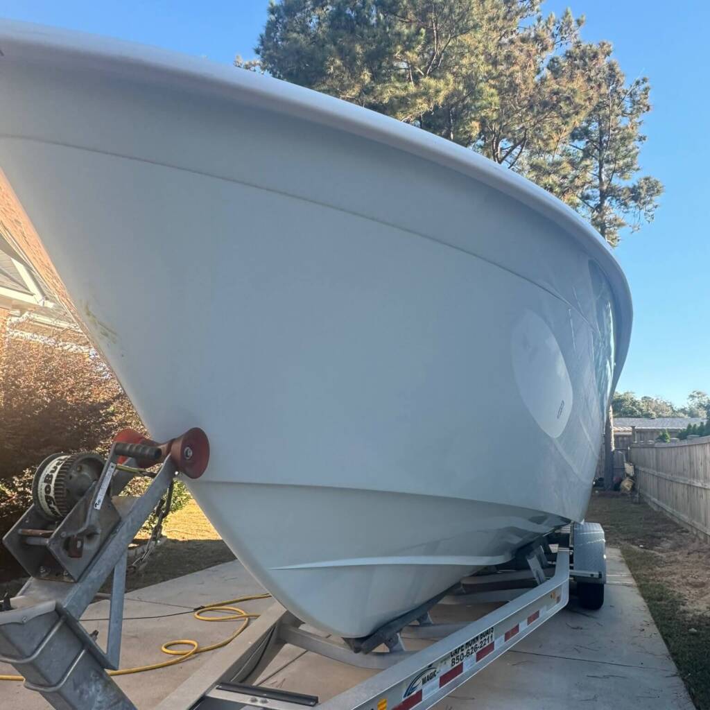 Clean white boat at sunset